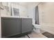 Bathroom features a vanity with gray cabinetry, with a shower and tub combination at 7649 Calico Fields St, Las Vegas, NV 89149