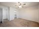 Bedroom with ceiling fan with an open closet and entrance to other rooms at 7649 Calico Fields St, Las Vegas, NV 89149