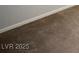 Close up of neutral toned, clean carpet installed along baseboards in home at 7649 Calico Fields St, Las Vegas, NV 89149