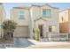 Charming two-story home featuring a garage, a cozy front porch, and a well-maintained yard at 7649 Calico Fields St, Las Vegas, NV 89149