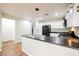 Modern kitchen with white cabinetry, black appliances, and a functional layout perfect for cooking and entertaining at 7649 Calico Fields St, Las Vegas, NV 89149