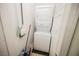 A compact, stacked washer and dryer unit tucked in a small room at 7649 Calico Fields St, Las Vegas, NV 89149