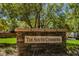 A stone sign reading 'The South Commons' is nestled among the trees and landscaping at 7649 Calico Fields St, Las Vegas, NV 89149