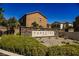 The community's decorative stone sign, “Tapestry by Astoria Homes” set among mature landscaping at 7649 Calico Fields St, Las Vegas, NV 89149