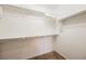 Spacious walk-in closet with built-in shelving and carpet flooring at 7649 Calico Fields St, Las Vegas, NV 89149