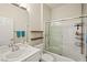 Clean and modern bathroom with a shower-tub combination and white vanity at 7904 Fantail Dr, North Las Vegas, NV 89084