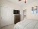 Bedroom featuring a queen-size bed, dresser, and closet with sliding doors at 7904 Fantail Dr, North Las Vegas, NV 89084