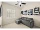 Comfortable bonus room with a convertible sofa and sports memorabilia displays at 7904 Fantail Dr, North Las Vegas, NV 89084