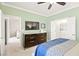 Spacious bedroom with a TV, dresser, and ensuite bathroom access at 7904 Fantail Dr, North Las Vegas, NV 89084