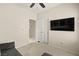 Neutral bedroom with carpeting and a TV mounted on the wall at 7904 Fantail Dr, North Las Vegas, NV 89084