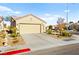 Charming home with a two-car garage, driveway, and landscaped front yard at 7904 Fantail Dr, North Las Vegas, NV 89084