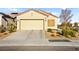 Charming single story home featuring a two-car garage and desert landscaping at 7904 Fantail Dr, North Las Vegas, NV 89084
