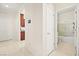 Hallway leading to kitchen and bathroom with tile flooring at 7904 Fantail Dr, North Las Vegas, NV 89084
