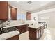Bright kitchen featuring stainless steel appliances, updated countertops, and an island at 7904 Fantail Dr, North Las Vegas, NV 89084