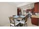 Charming kitchen with stainless steel appliances, wooden cabinetry, and a cozy dining area at 7904 Fantail Dr, North Las Vegas, NV 89084