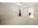 The room is filled with natural light, highlighting the neutral color palette, and carpeted floor at 7904 Fantail Dr, North Las Vegas, NV 89084