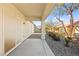 Covered patio area with gravel landscaping and view of the neighboring buildings at 7904 Fantail Dr, North Las Vegas, NV 89084