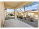 Covered patio area with gravel landscaping and view of the neighboring buildings at 7904 Fantail Dr, North Las Vegas, NV 89084