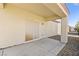 Covered patio area with gravel landscaping and a sliding glass door at 7904 Fantail Dr, North Las Vegas, NV 89084
