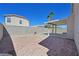Desert landscaped backyard with covered patio, walled for privacy; ideal for low-maintenance living at 8472 W Gilmore Ave, Las Vegas, NV 89129