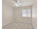 This bedroom has neutral carpeting and good natural light at 8472 W Gilmore Ave, Las Vegas, NV 89129