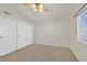 This bedroom has neutral carpeting, and ample closet space for storage at 8472 W Gilmore Ave, Las Vegas, NV 89129