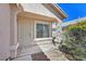 Inviting front porch with security gate and desert plants at 8472 W Gilmore Ave, Las Vegas, NV 89129