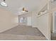 Bright living room features neutral paint, large window, and a ceiling fan at 8472 W Gilmore Ave, Las Vegas, NV 89129