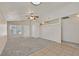 Bright living room features neutral paint, large window, and a ceiling fan at 8472 W Gilmore Ave, Las Vegas, NV 89129