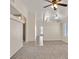 Bright living room features neutral paint, large window, and a ceiling fan at 8472 W Gilmore Ave, Las Vegas, NV 89129