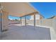 This spacious covered patio features a concrete floor and is perfect for outdoor entertaining at 8472 W Gilmore Ave, Las Vegas, NV 89129
