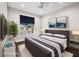 Bedroom offers a large window, sleek TV, soft rug and stylish decor at 8705 Red Brook Dr # 203, Las Vegas, NV 89128