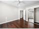 Bedroom with wood floors and mirror closet at 8705 Red Brook Dr # 203, Las Vegas, NV 89128