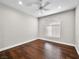 Bright bedroom with hardwood floors, a ceiling fan and a window with blinds at 8705 Red Brook Dr # 203, Las Vegas, NV 89128