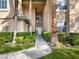 Condo exterior showcasing a well-maintained walkway and lush landscaping at 8705 Red Brook Dr # 203, Las Vegas, NV 89128