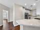 Bright kitchen with white cabinets, modern appliances, and stone countertops at 8705 Red Brook Dr # 203, Las Vegas, NV 89128