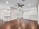 Open-concept living space with rich hardwood floors and neutral color palette at 8705 Red Brook Dr # 203, Las Vegas, NV 89128