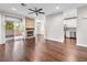 Living room features a fireplace, dark hardwood flooring, and access to a balcony at 8705 Red Brook Dr # 203, Las Vegas, NV 89128