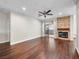 Bright living room featuring a stone fireplace, ceiling fan, and sliding glass doors to the outdoor patio at 8705 Red Brook Dr # 203, Las Vegas, NV 89128
