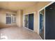 Covered patio space with tiled floors and sliding glass doors, perfect for outdoor relaxation at 8705 Red Brook Dr # 203, Las Vegas, NV 89128