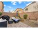 Backyard space featuring a patio with outdoor furniture, a grill, and privacy fencing at 9120 Mastodon Ave, Las Vegas, NV 89149