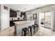 Modern kitchen with granite countertops, dark cabinets, and stainless steel appliances at 9120 Mastodon Ave, Las Vegas, NV 89149