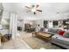 Bright and open living area with tile flooring flowing into a dining and kitchen space at 9120 Mastodon Ave, Las Vegas, NV 89149
