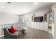 Upstairs loft with chair, tv and built-in shelving at 9120 Mastodon Ave, Las Vegas, NV 89149