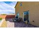 Inviting backyard with a brick-paved patio and outdoor dining set, perfect for entertaining at 9160 Lynea Ct, Las Vegas, NV 89178