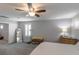 Large primary bedroom space with ceiling fan, natural light, and en-suite bathroom at 9160 Lynea Ct, Las Vegas, NV 89178