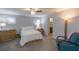 Large primary bedroom with a connecting bathroom and sitting area at 9160 Lynea Ct, Las Vegas, NV 89178
