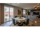 Bright dining area with sliding glass doors leading to an outdoor patio seating at 9160 Lynea Ct, Las Vegas, NV 89178