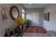 Inviting foyer area with a decorative mirror, console table, and tiled floor at 9160 Lynea Ct, Las Vegas, NV 89178