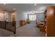 Upstairs loft provides versatile space, complete with ceiling fan, neutral walls, and plush carpeting at 9160 Lynea Ct, Las Vegas, NV 89178